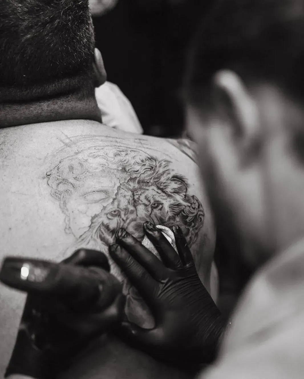 Nick tattooing the back piece in black and white